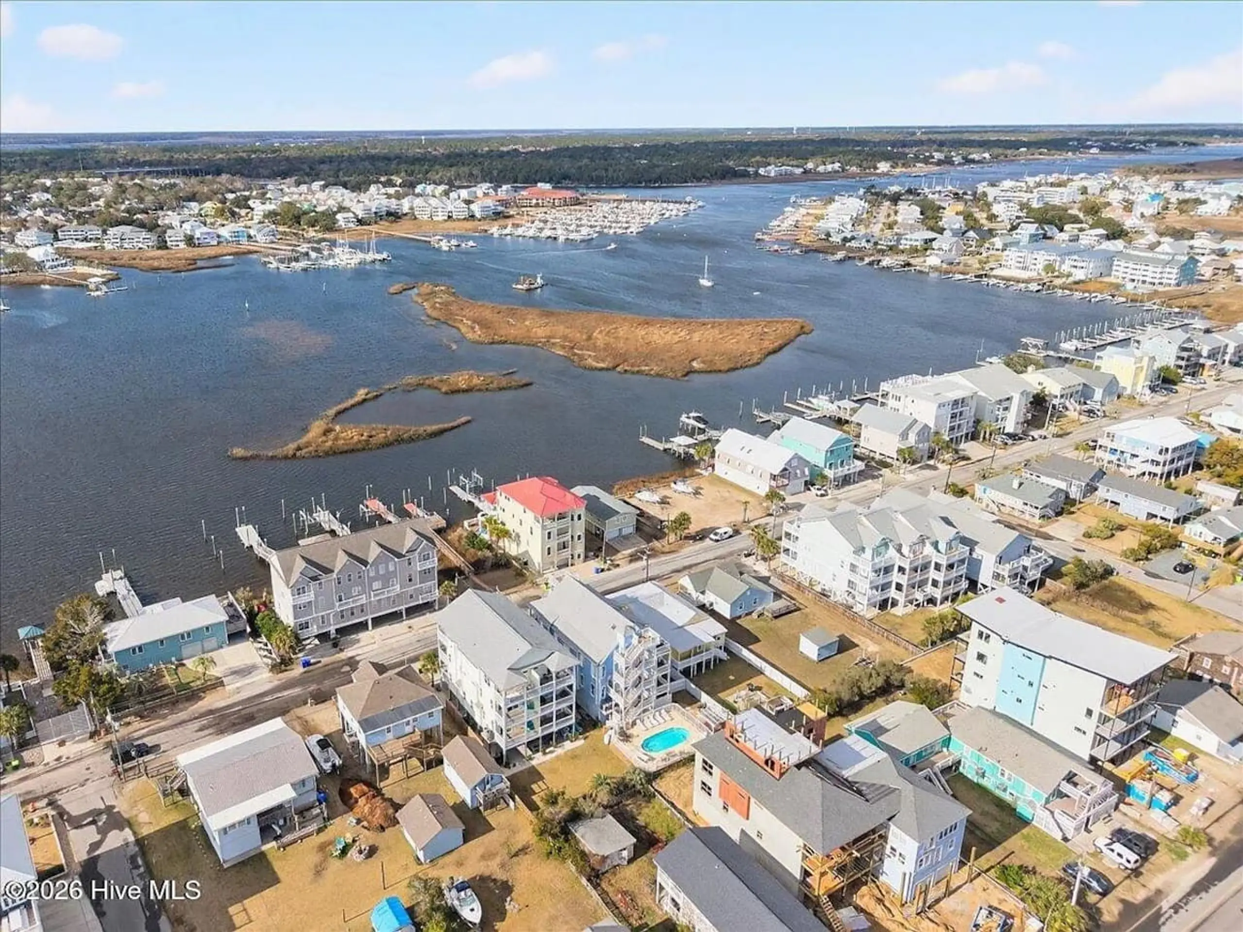 Aerial view of waterfront homes and marina