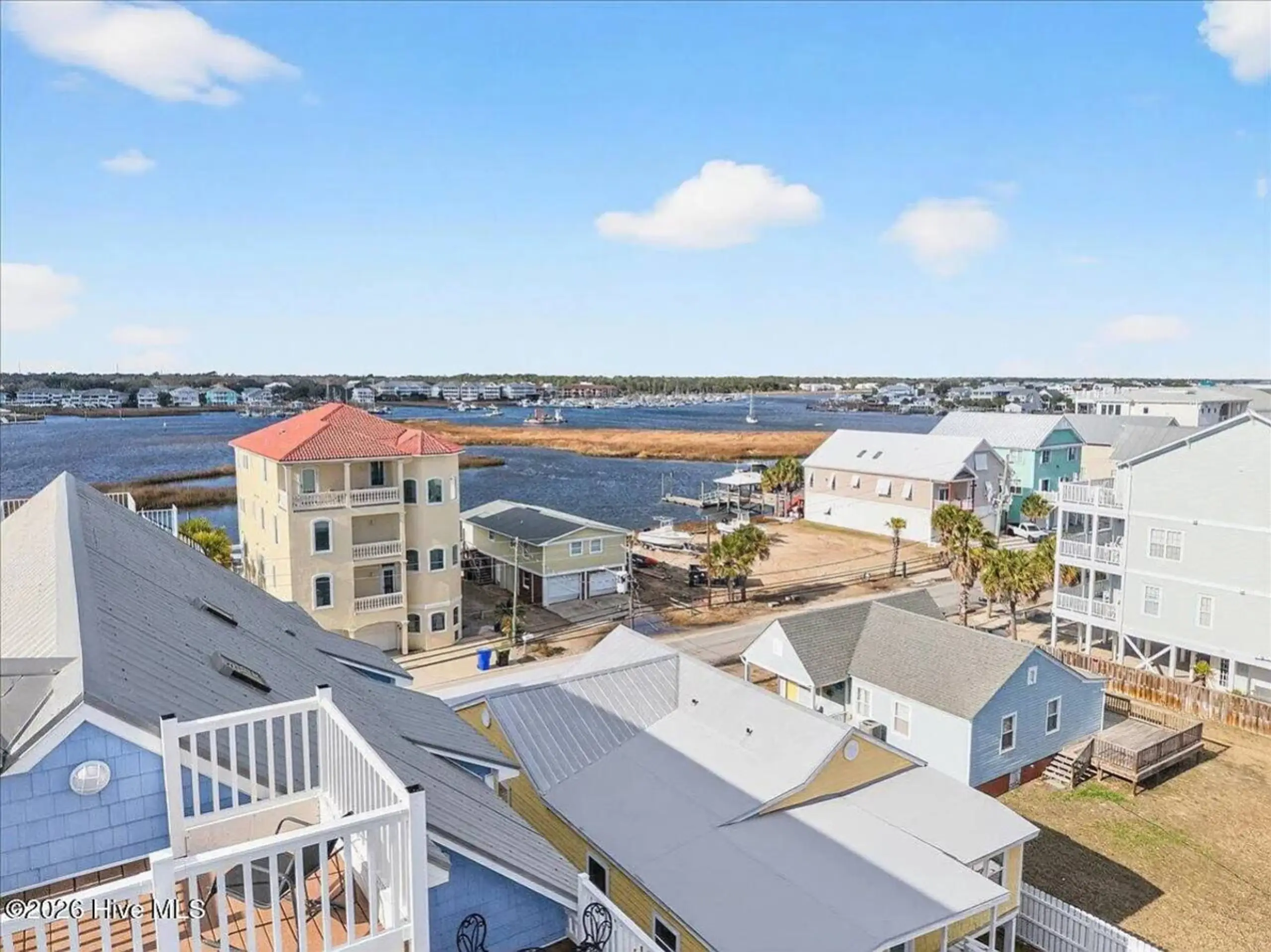 Aerial view of coastal homes and inlet