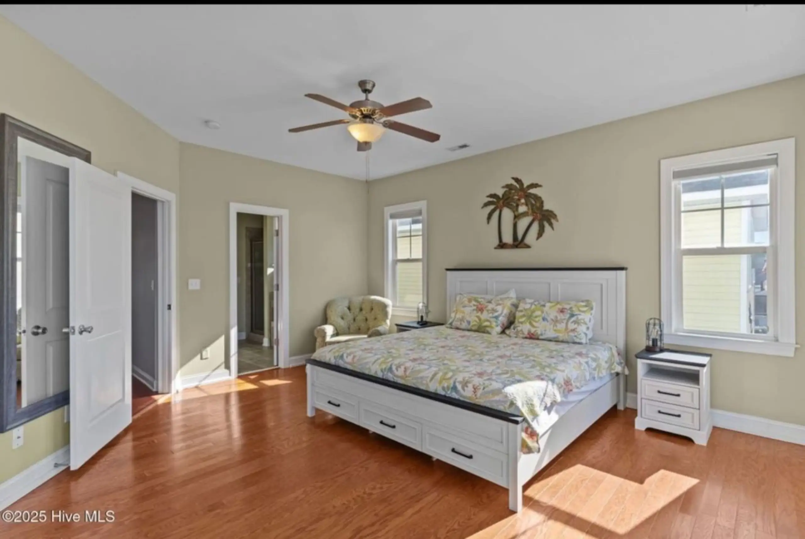 Bright master bedroom with floral bedding