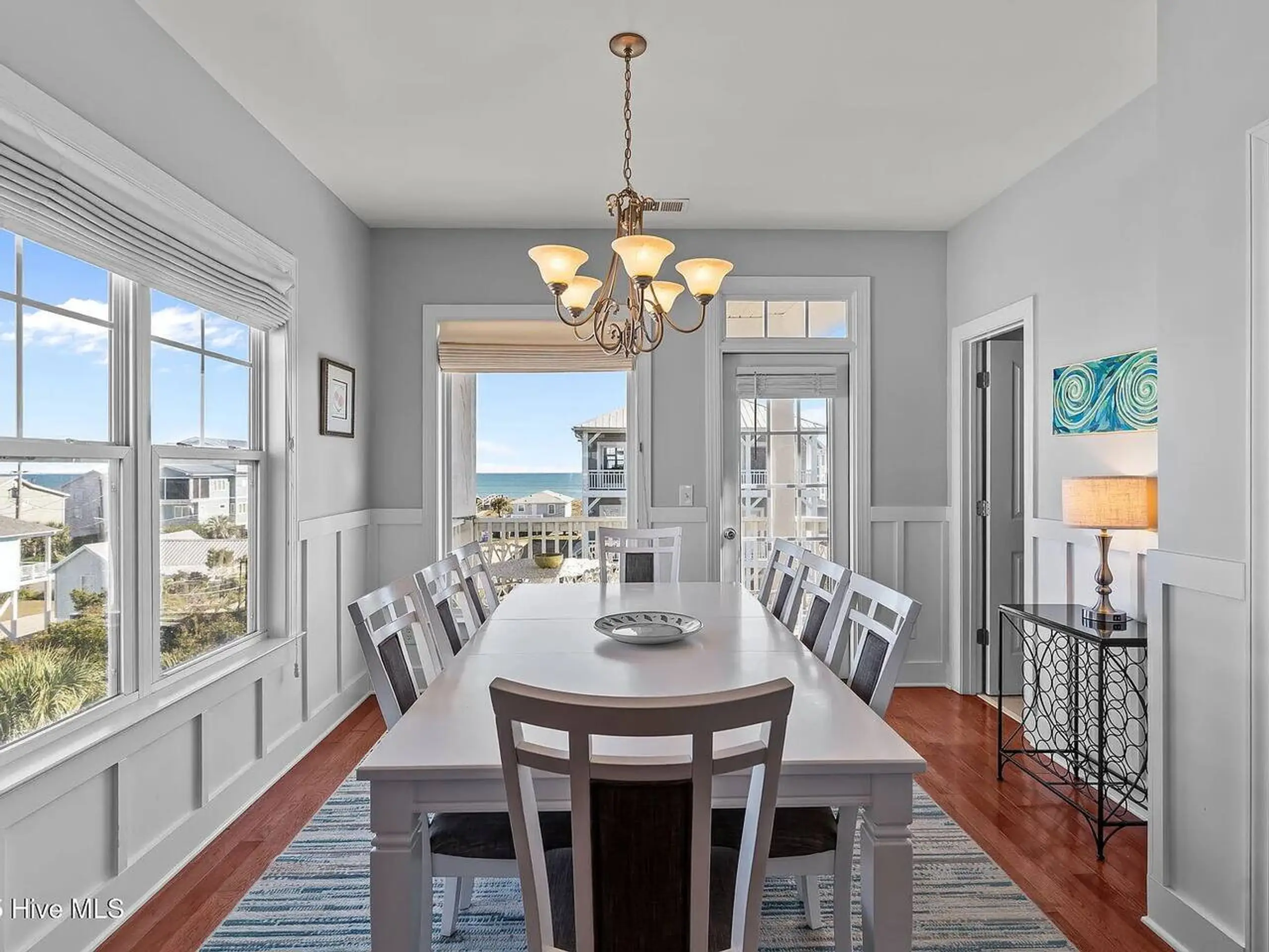 Sunlit dining room with ocean view