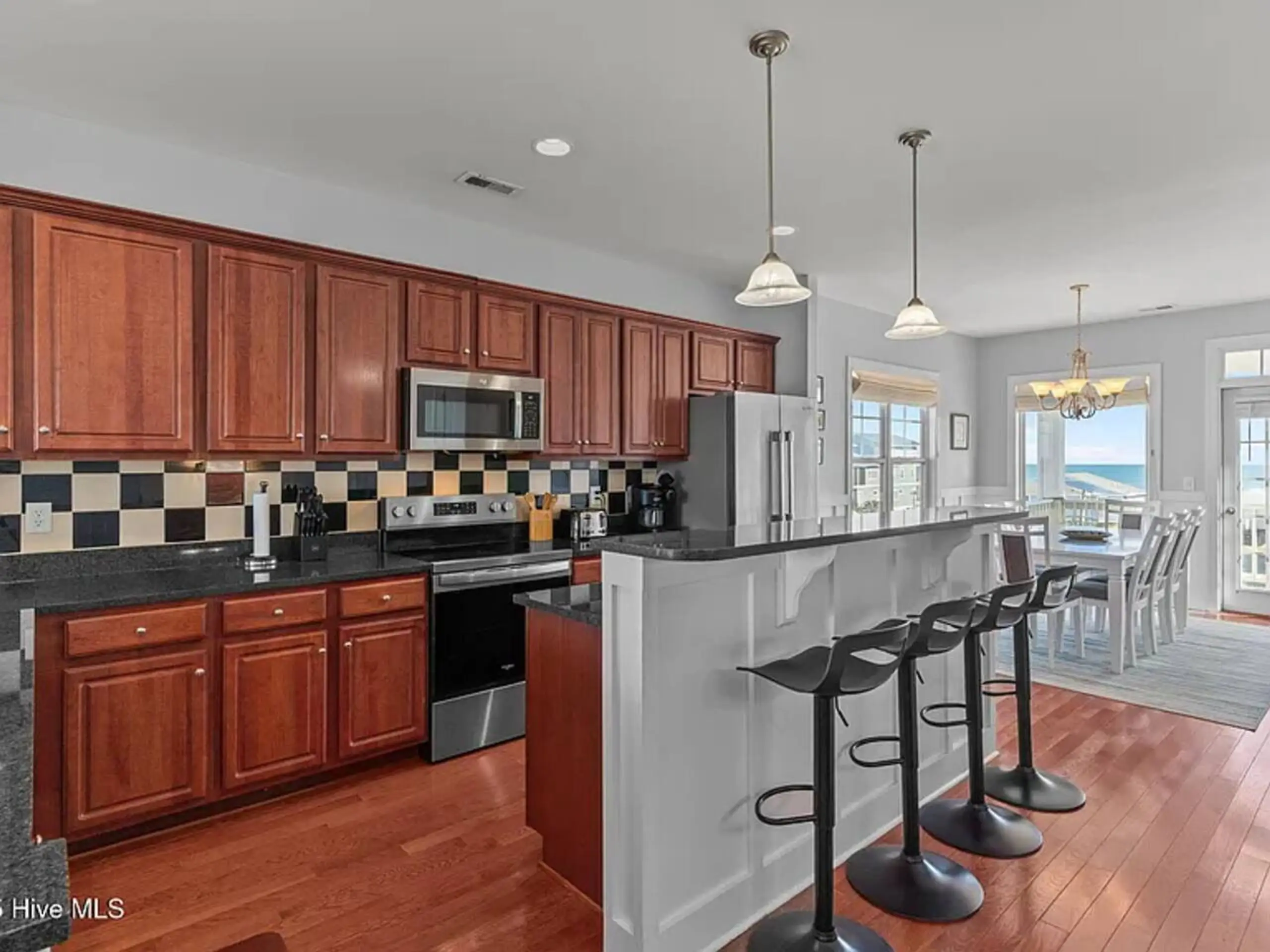 Open kitchen with island and ocean view