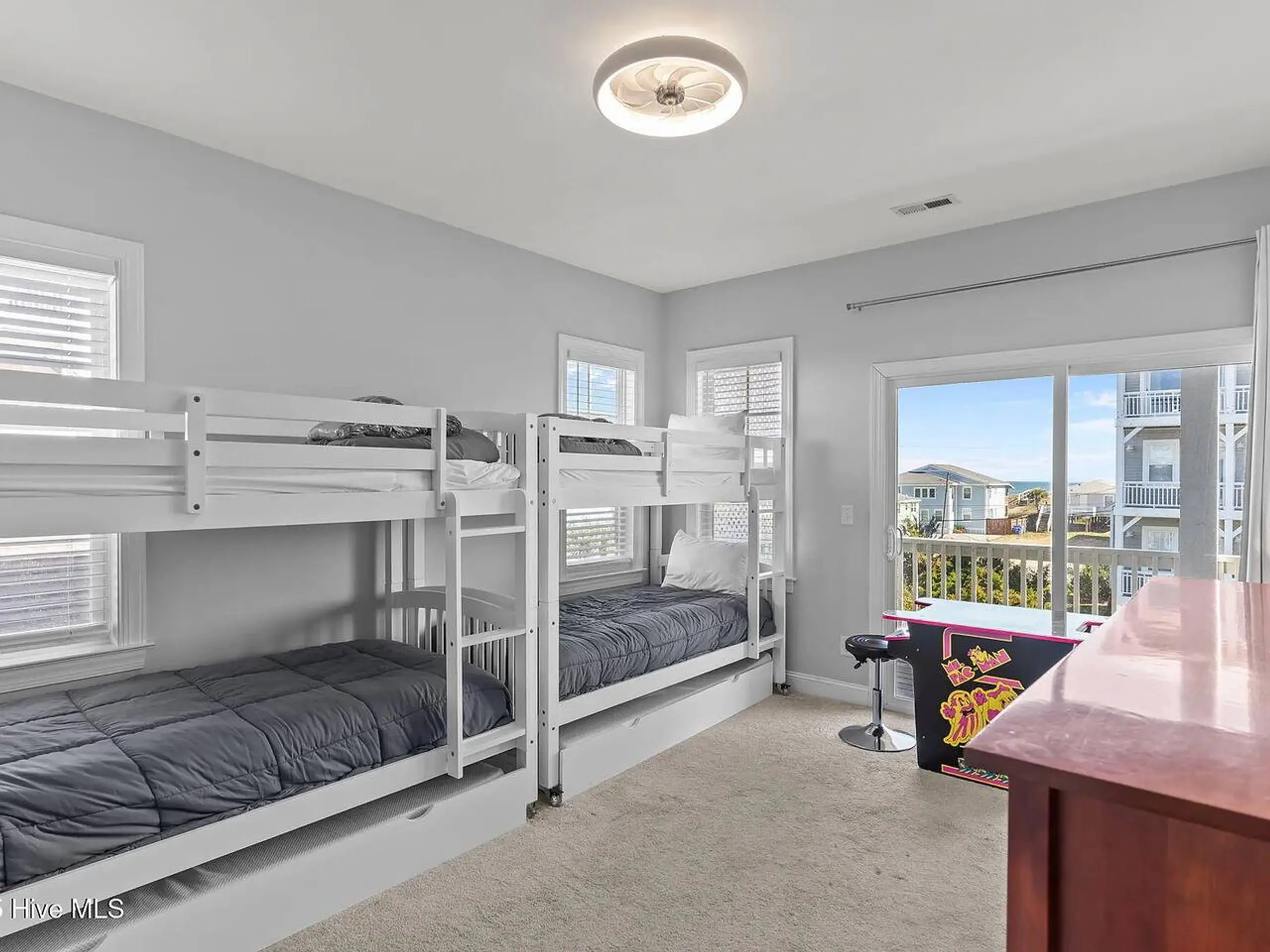 Bright bedroom with white twin bunk beds