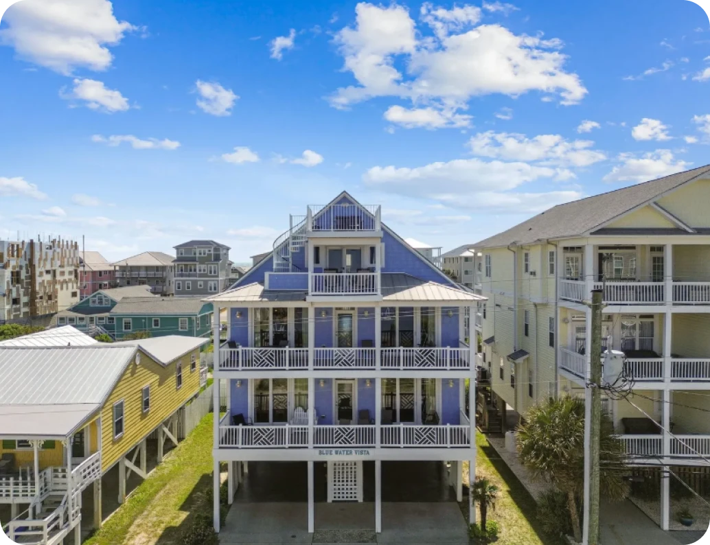 Beachfront houses under blue sky