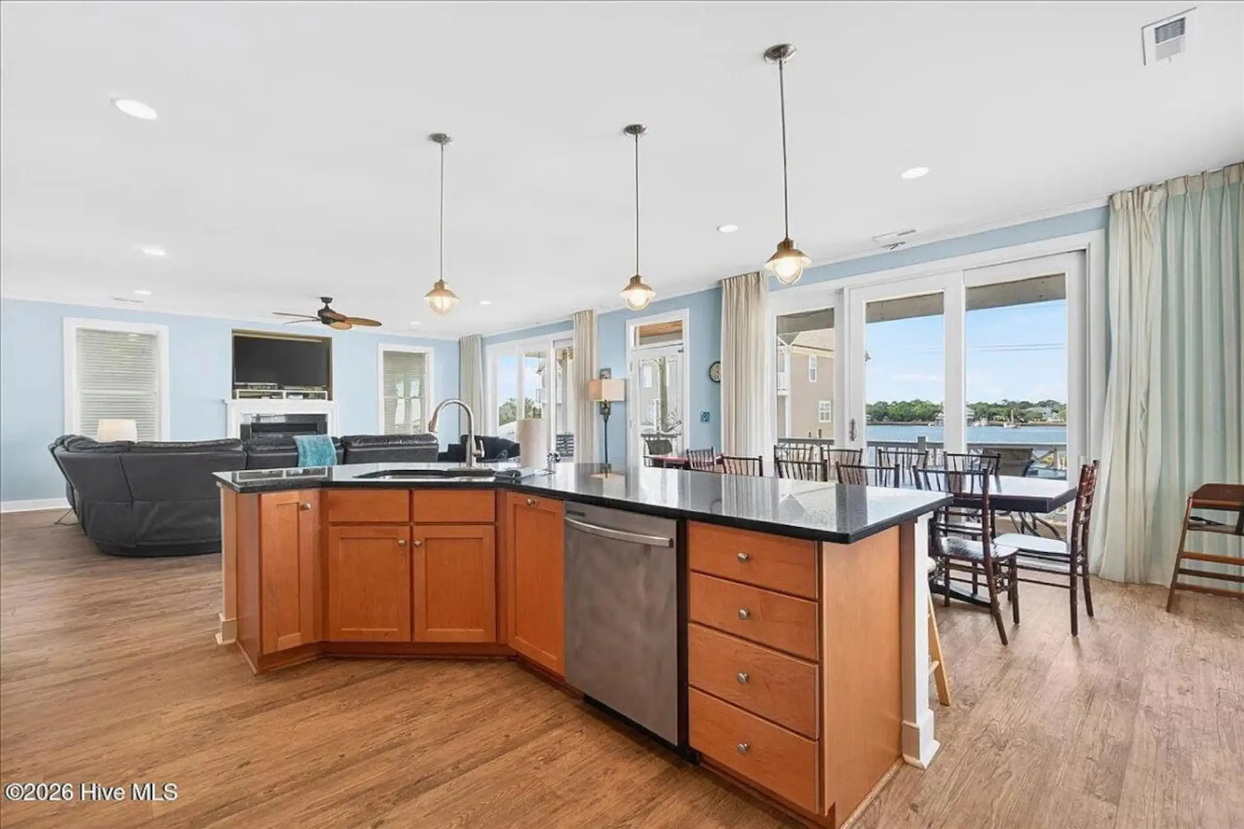 Open kitchen with island and waterfront view