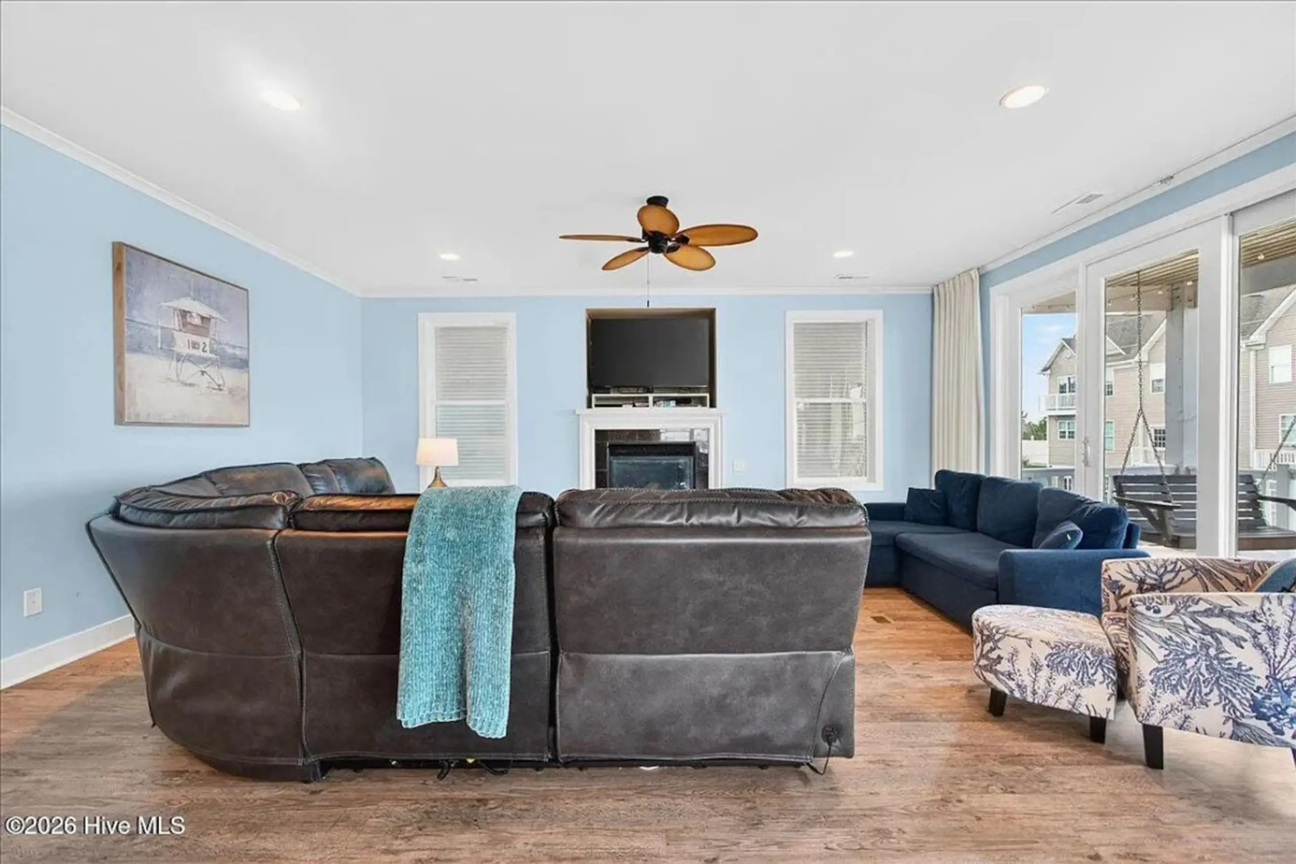 Coastal living room with leather sectional sofa